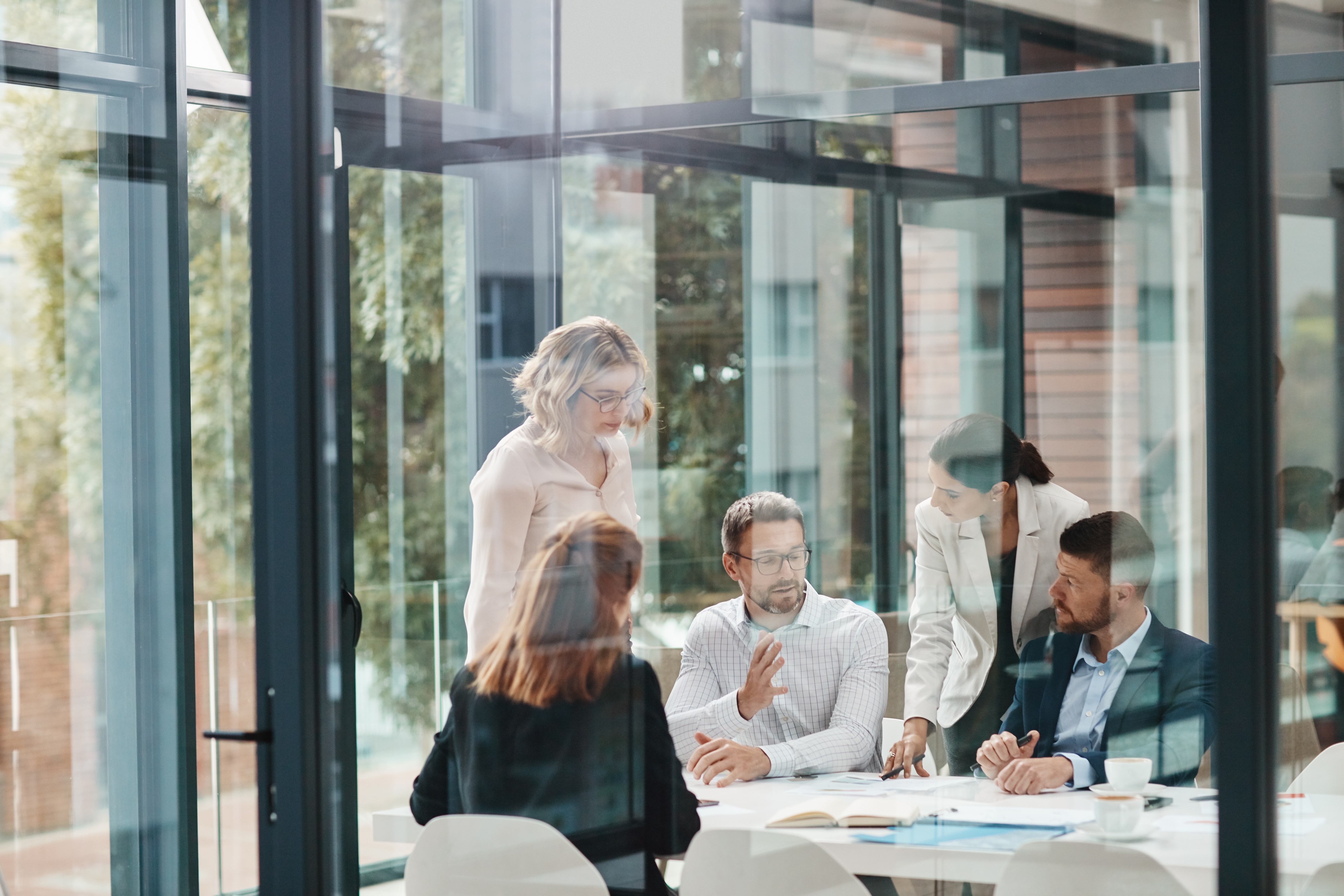 A team reviewing documents together in a meeting room